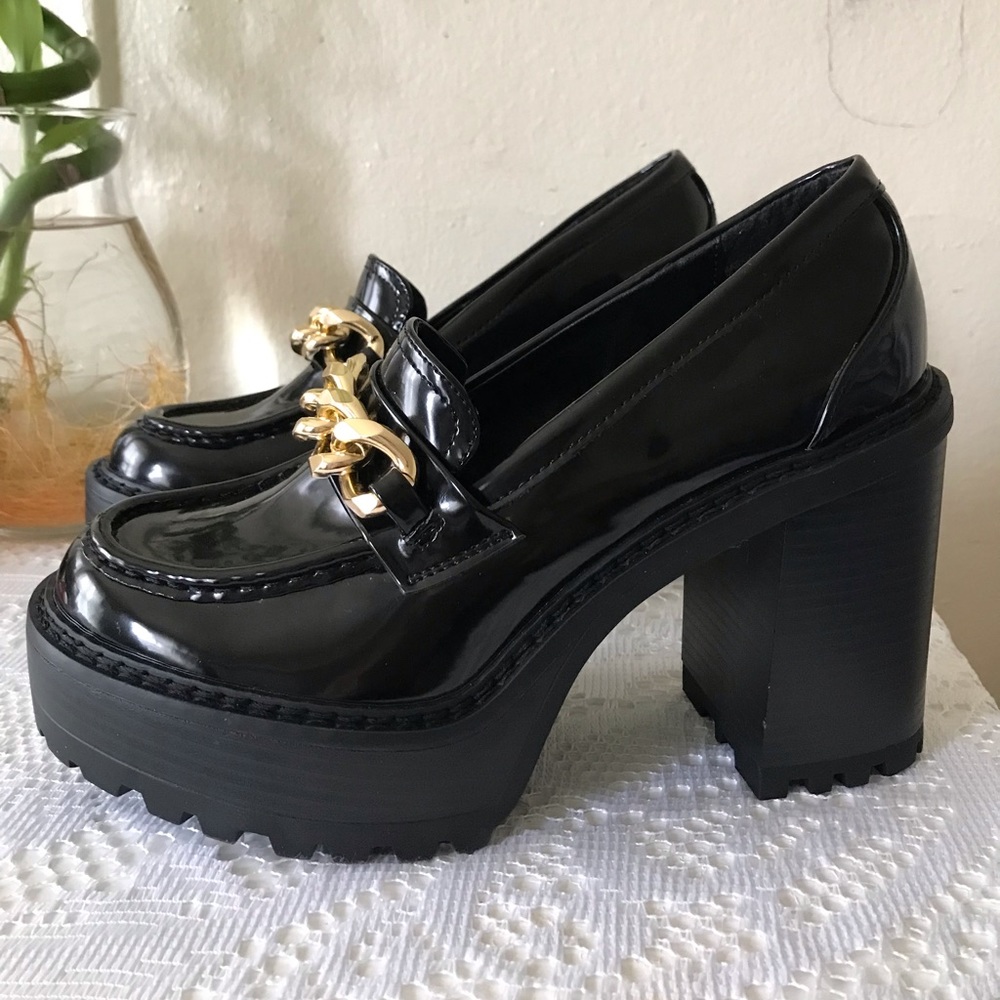 Brand new Madden girl size 7 black platform loafers with gold chain.